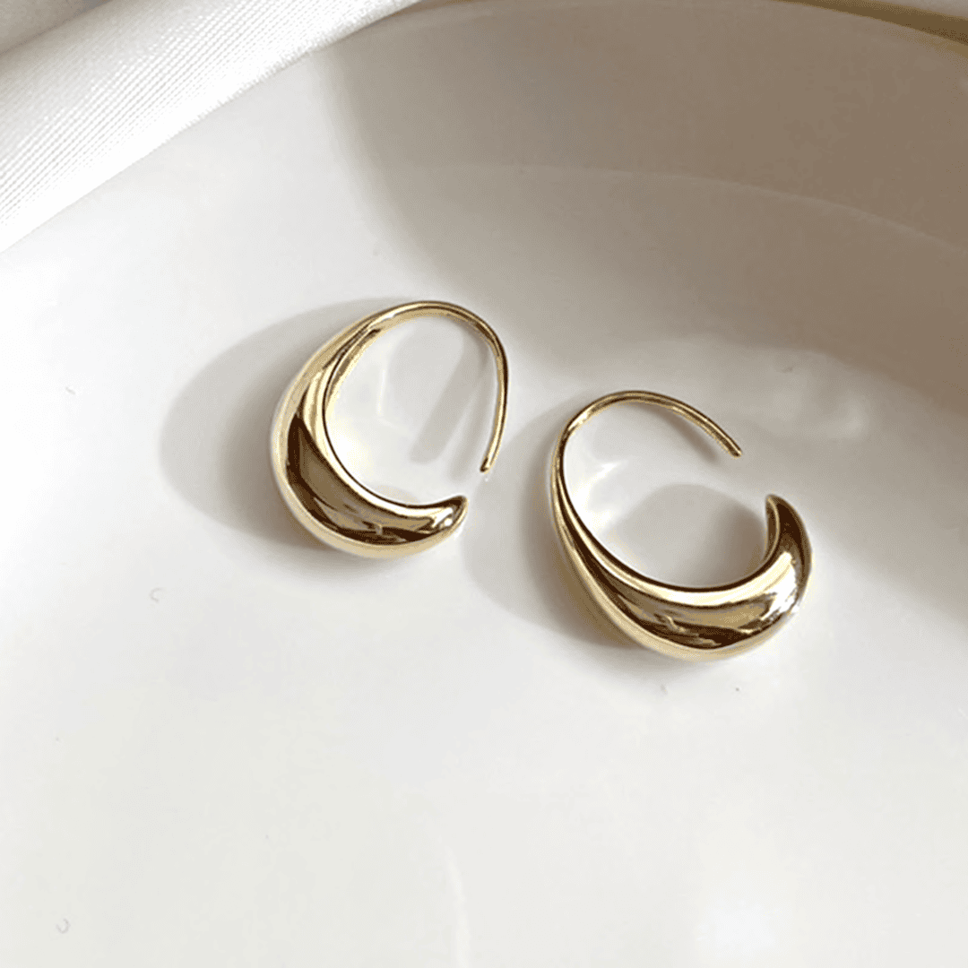 Ovale hoop-øreringe i guld og sølv
