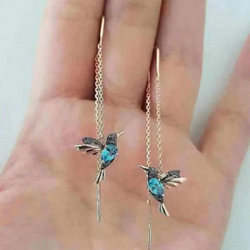 Tråd-øreringe med kolibri i guld og krystaller