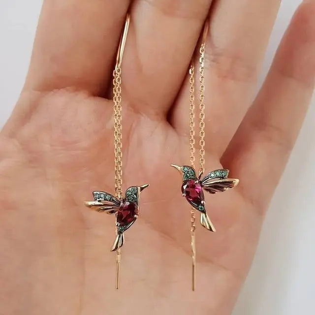 Tråd-øreringe med kolibri i guld og krystaller